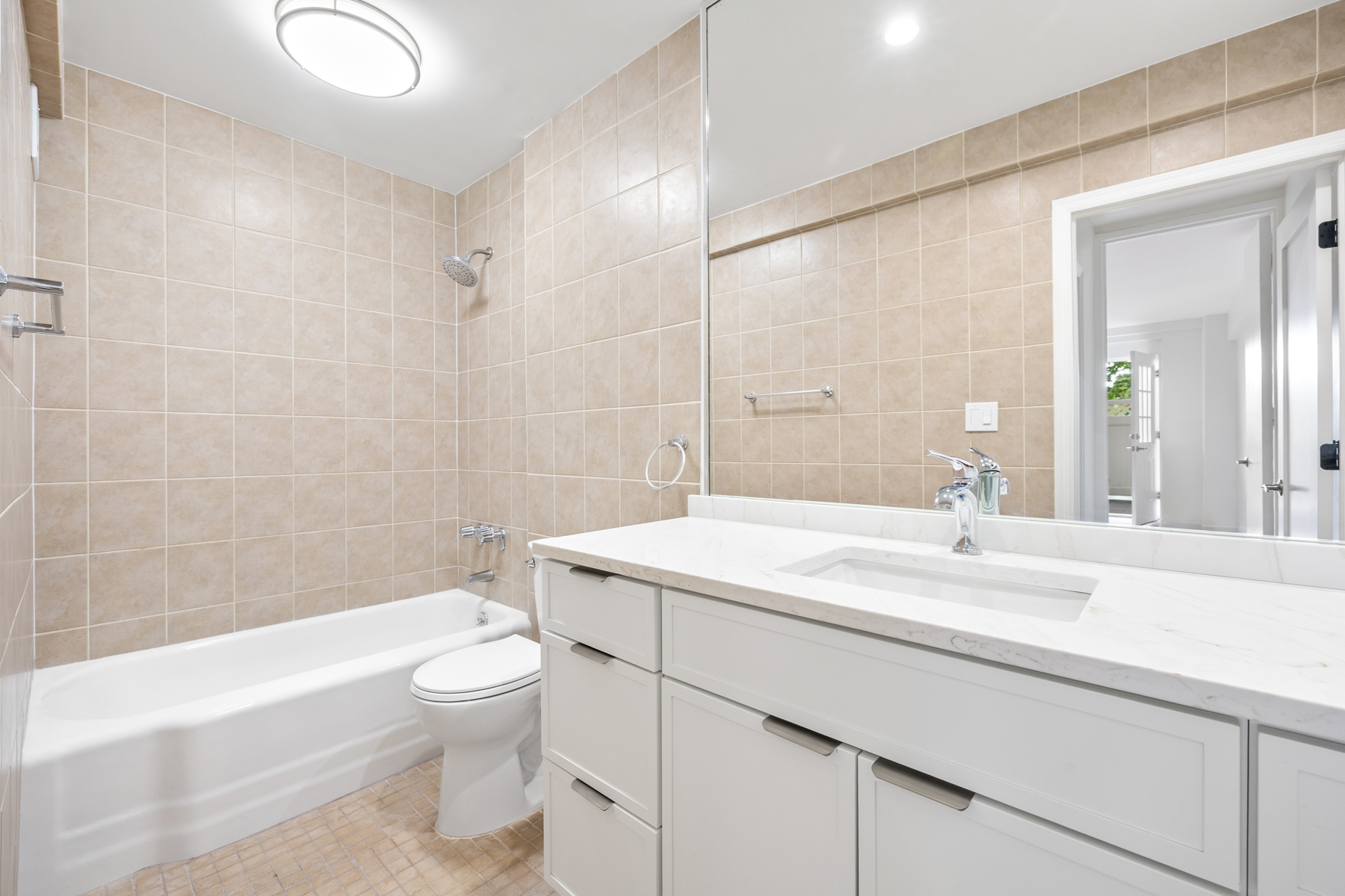 35-20 Leverich Street, Unit B226 Queens, NY 11372 - Photo 11 of 15 a bathroom with a sink a toilet and a bathtub