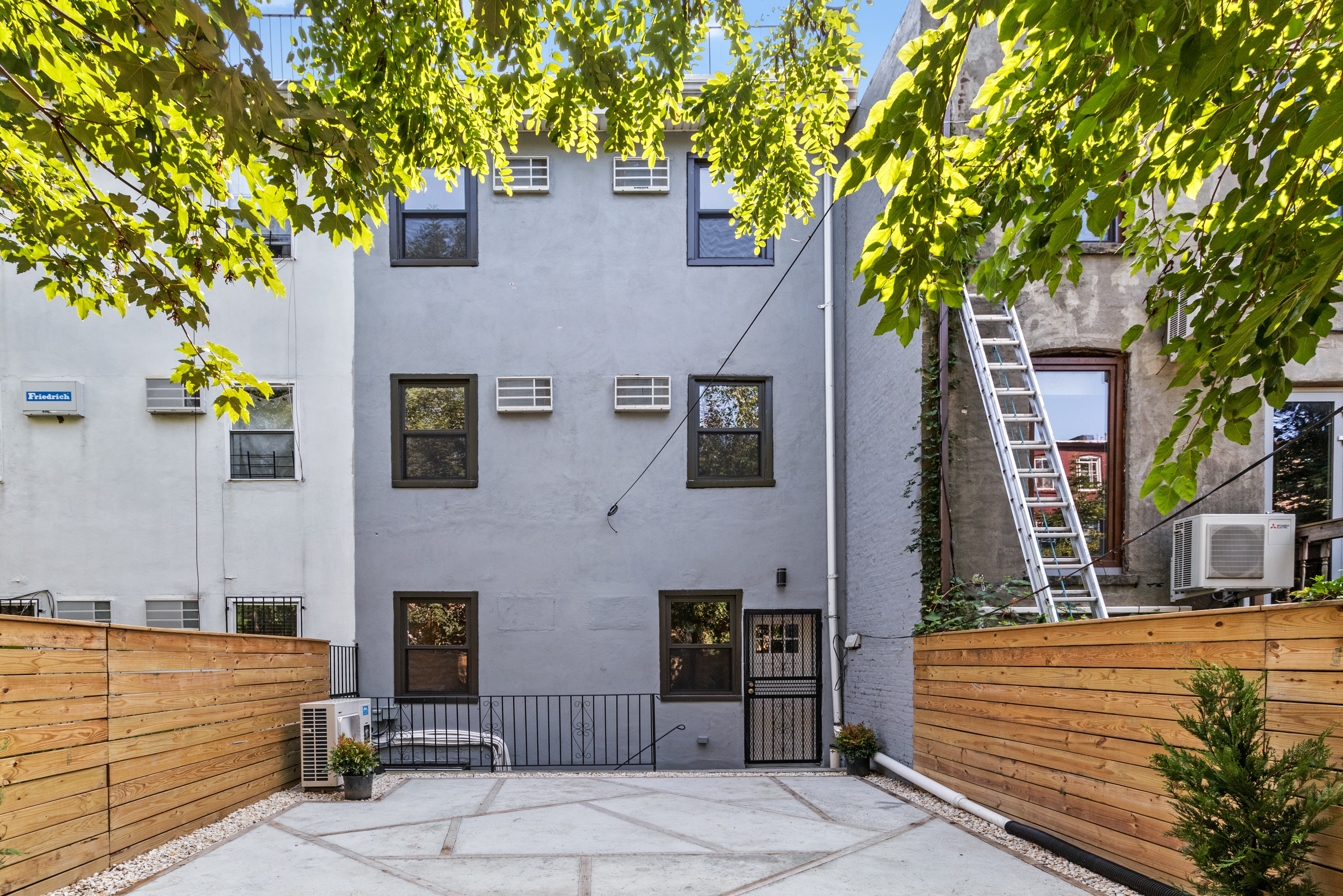 791 Lexington Avenue, Unit 2 Brooklyn, NY 11221 - Photo 18 of 19 a view of a building with a tree
