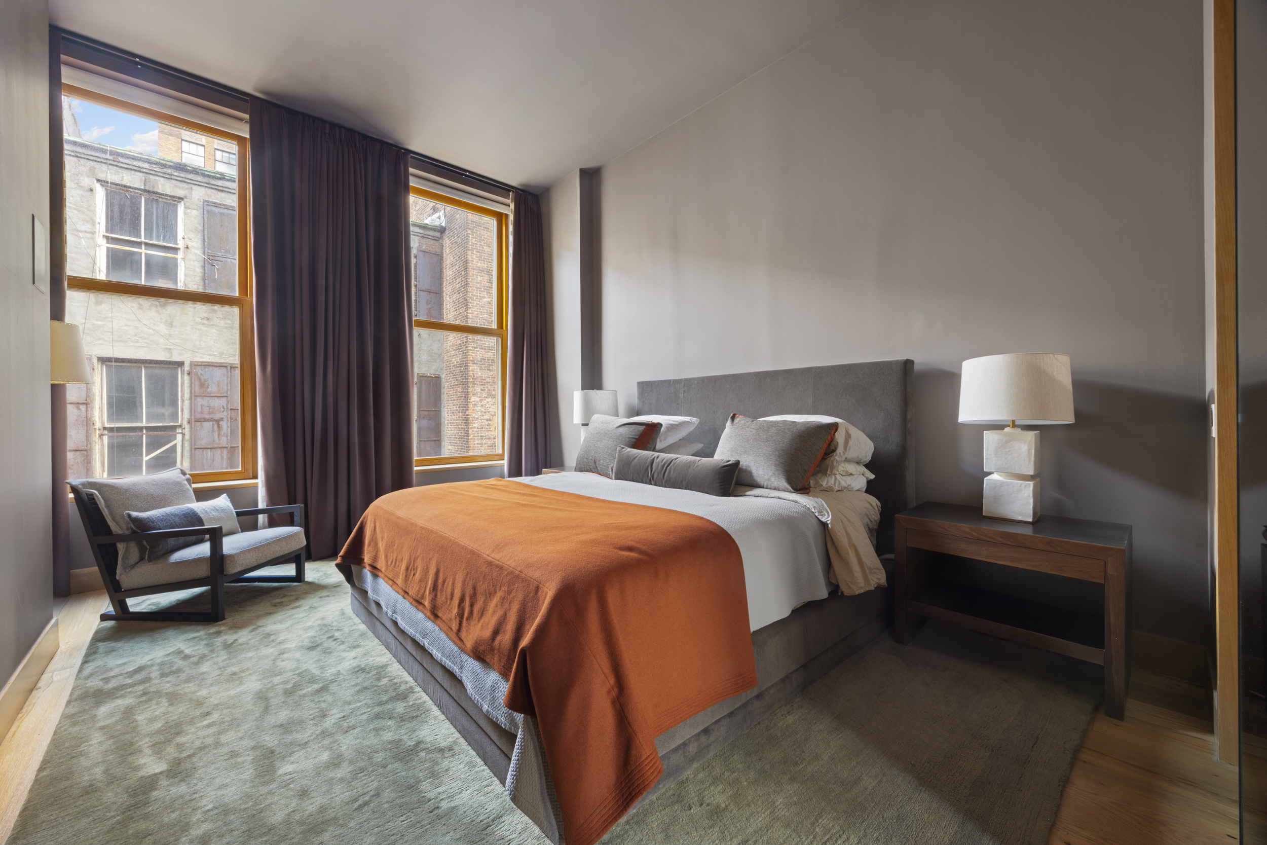 60 White Street, Unit 4E Manhattan, NY 10013 - Photo 11 of 19 a spacious bedroom with a bed and wooden floor