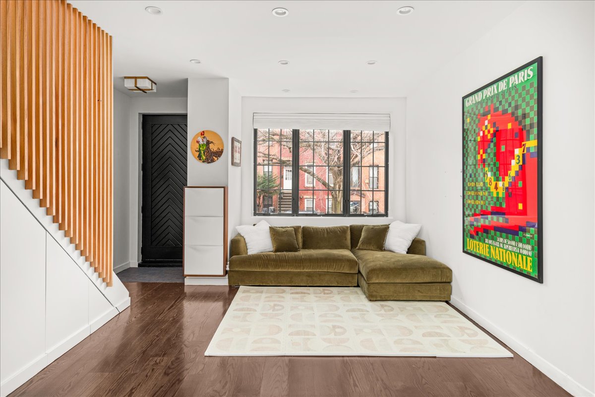 211 14th Street Brooklyn, NY 11215 - Photo 1 of 18 a living room with furniture and a large window