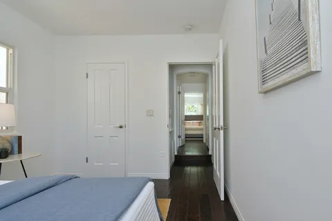 a bedroom with a large bed and a couch
