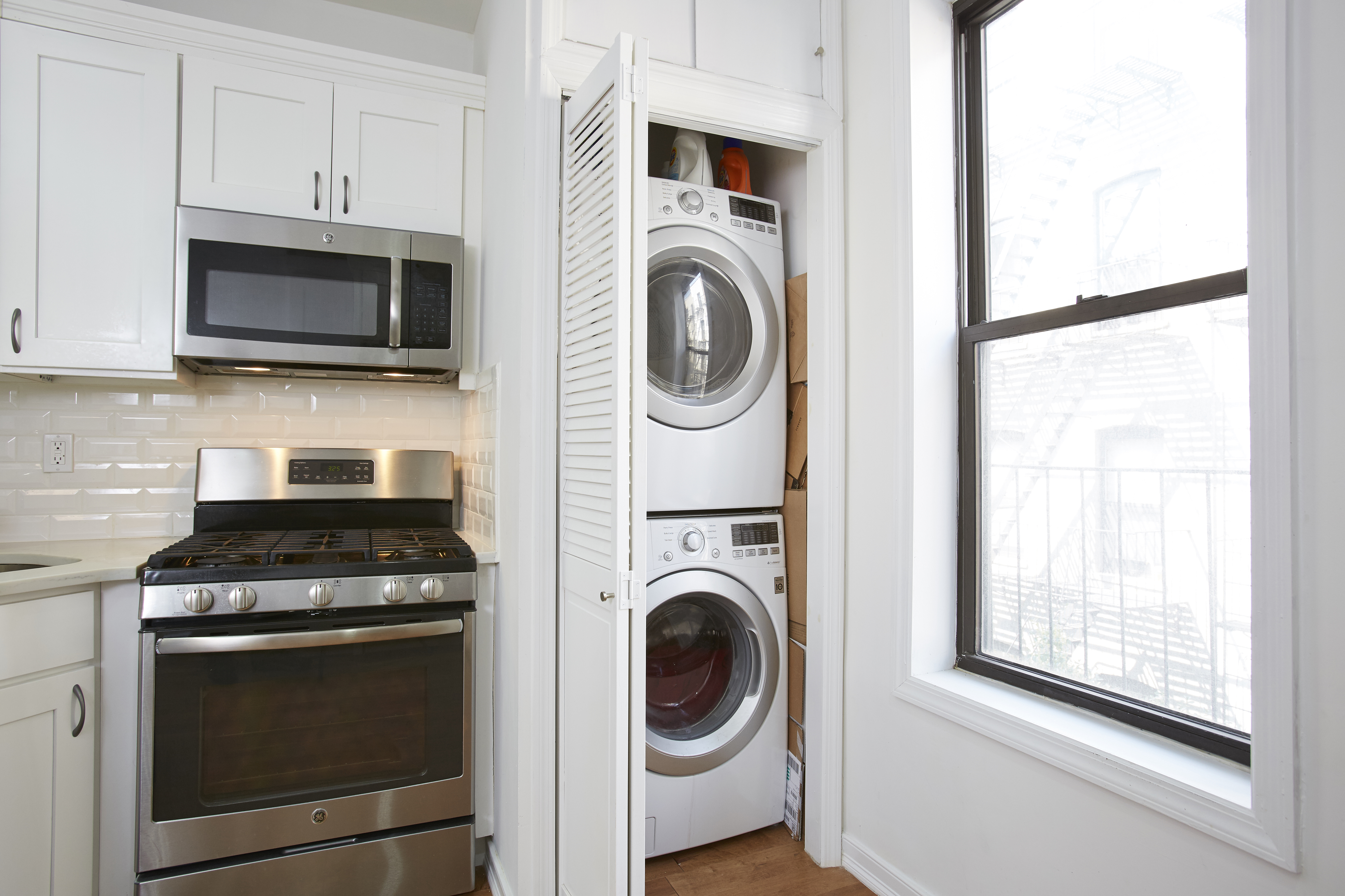 567 6th Street, Unit 7 Brooklyn, NY 11215 - Photo 2 of 9 a kitchen with a stove and a microwave