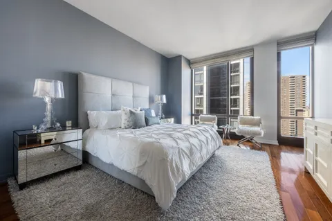 a bedroom with a bed and a couch