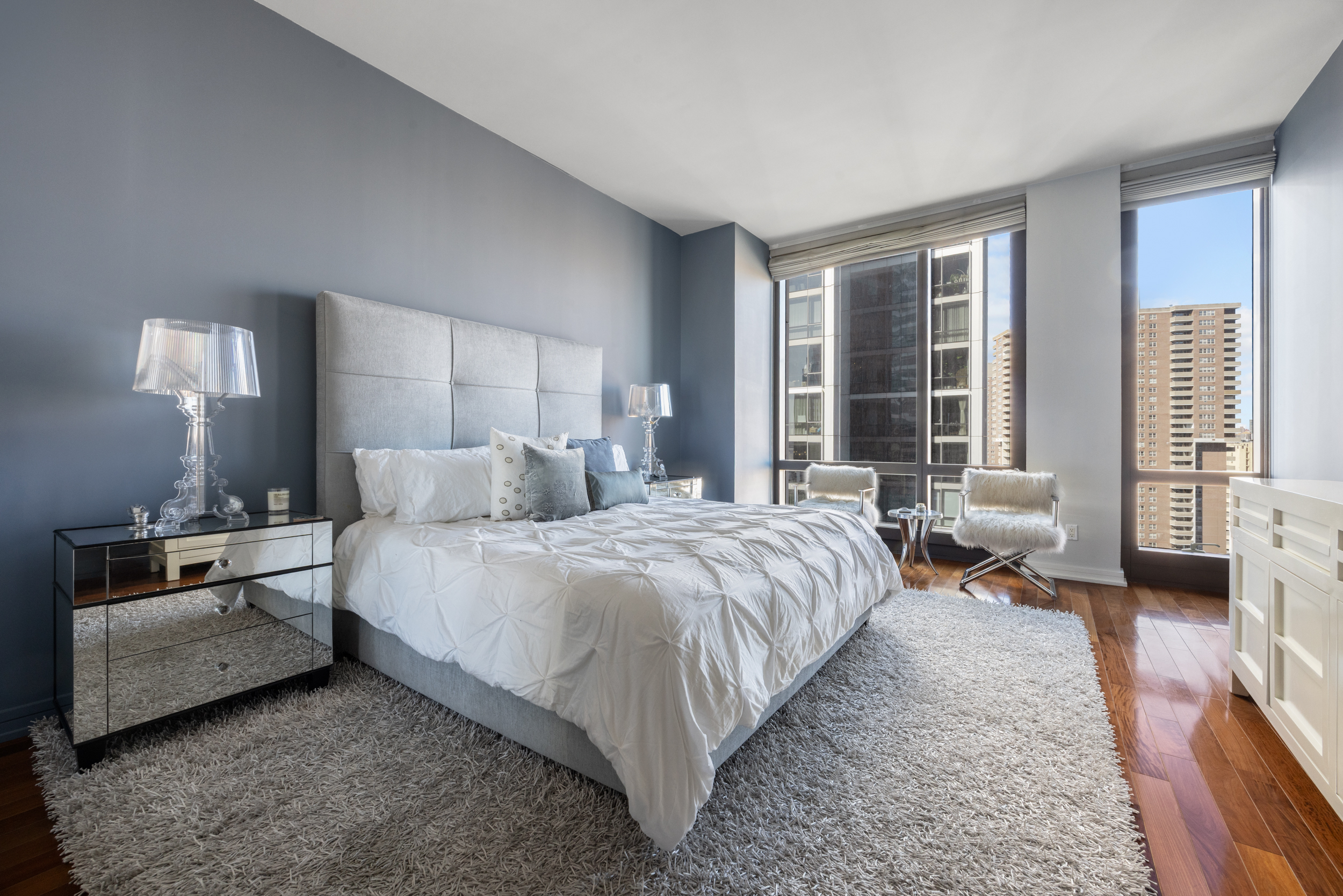 101 Warren Street, Unit 2220 Manhattan, NY 10007 - Photo 9 of 19 a bedroom with a bed and a couch