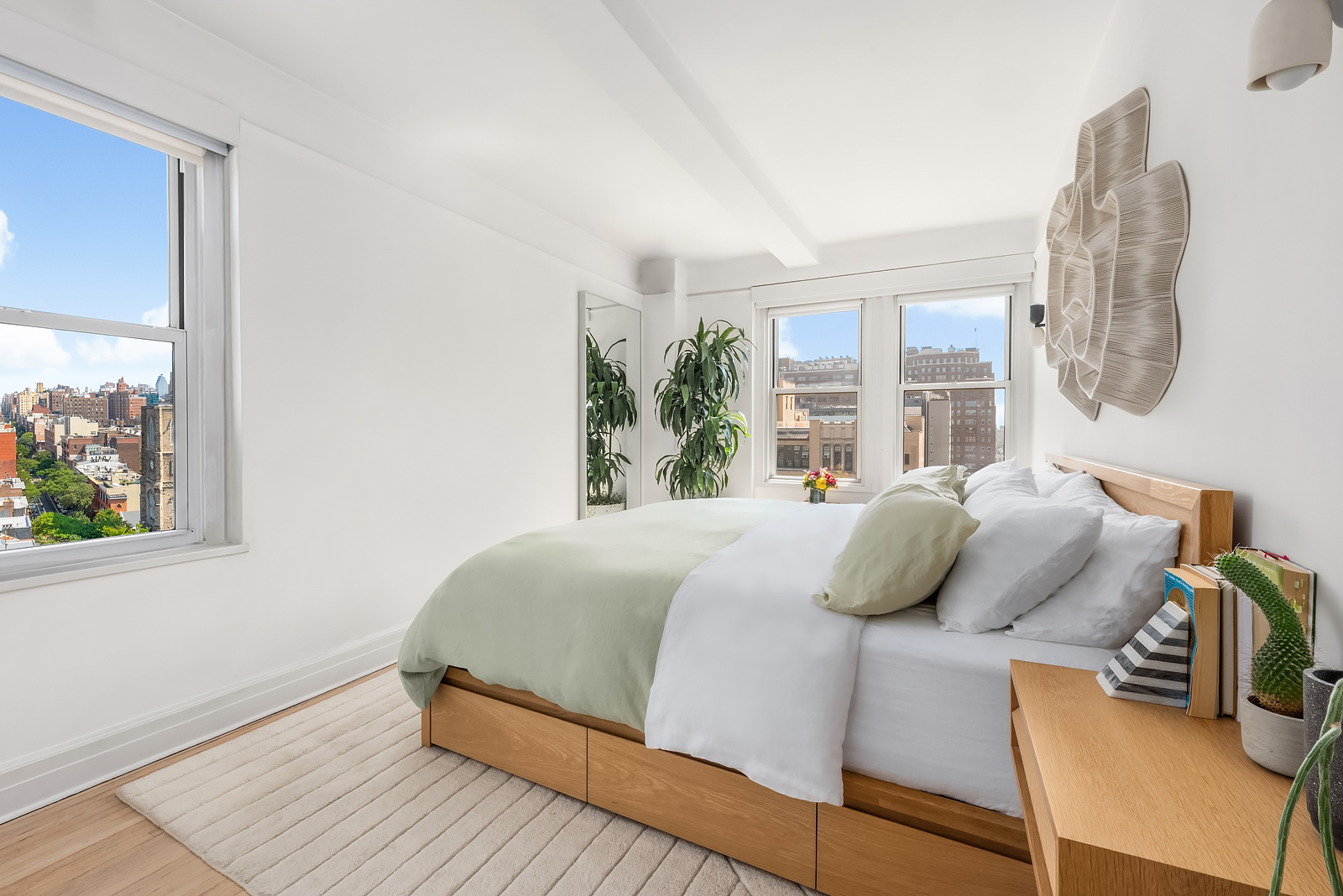 365 West 20th Street, Unit 14B Manhattan, NY 10011 - Photo 11 of 21 a bedroom with a bed and wooden floor