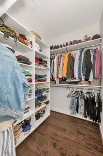 a view of balcony with wooden floor and outdoor seating