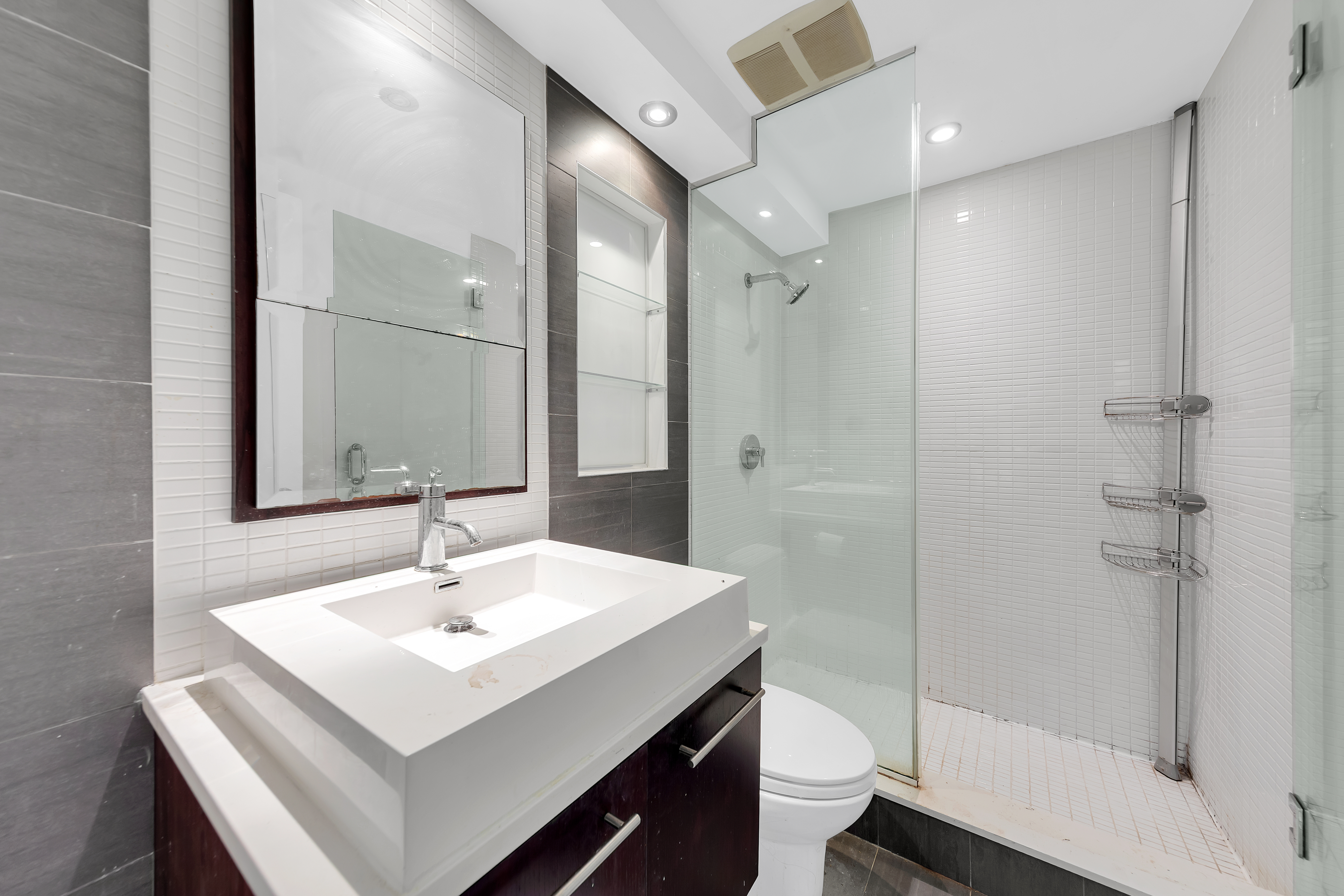 658 Bergen Street, Unit 3E Brooklyn, NY 11238 - Photo 5 of 8 a bathroom with a sink toilet and shower