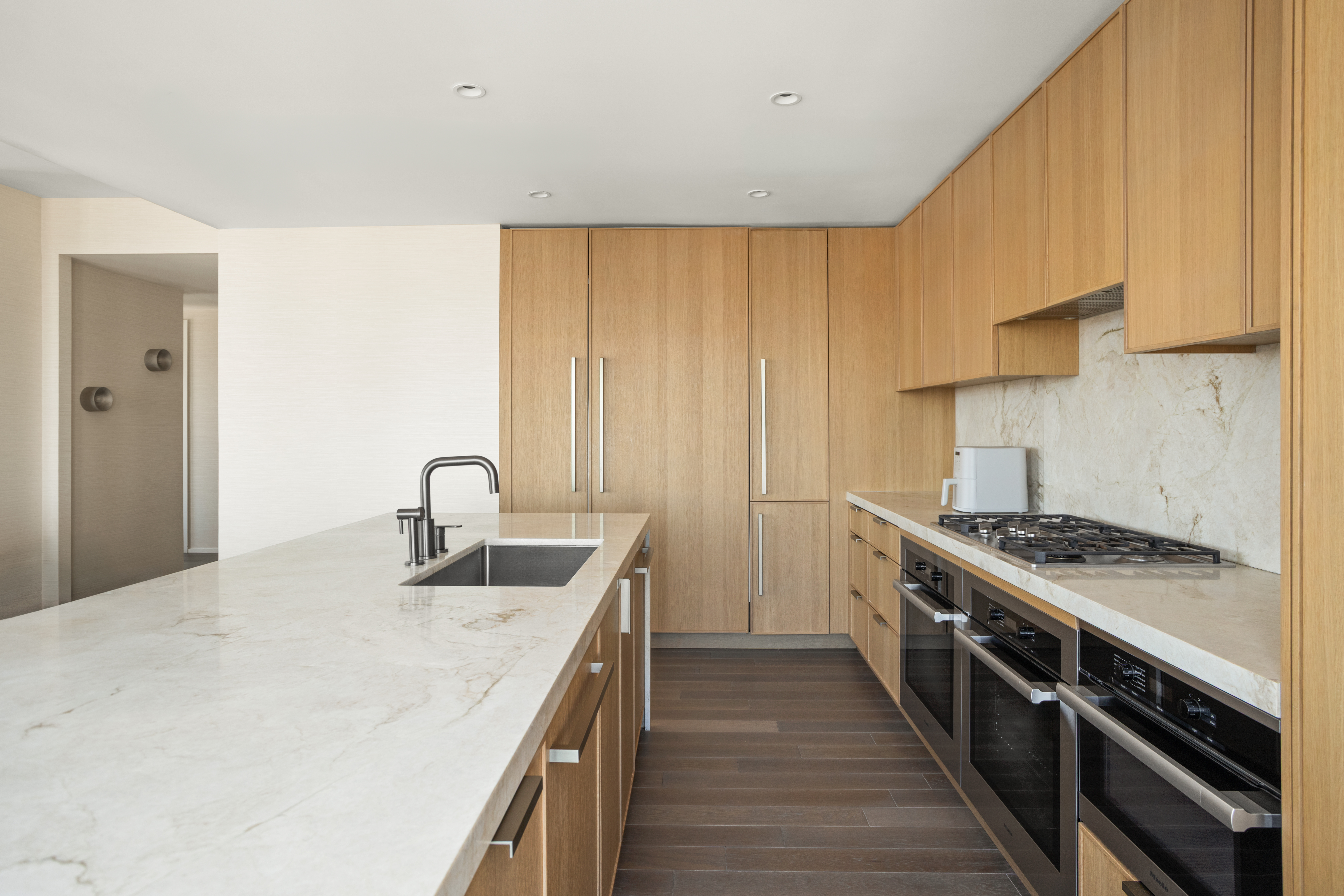 543 West 122nd Street, Unit PH31A Manhattan, NY 10027 - Photo 14 of 40 a kitchen with a sink stove and cabinets