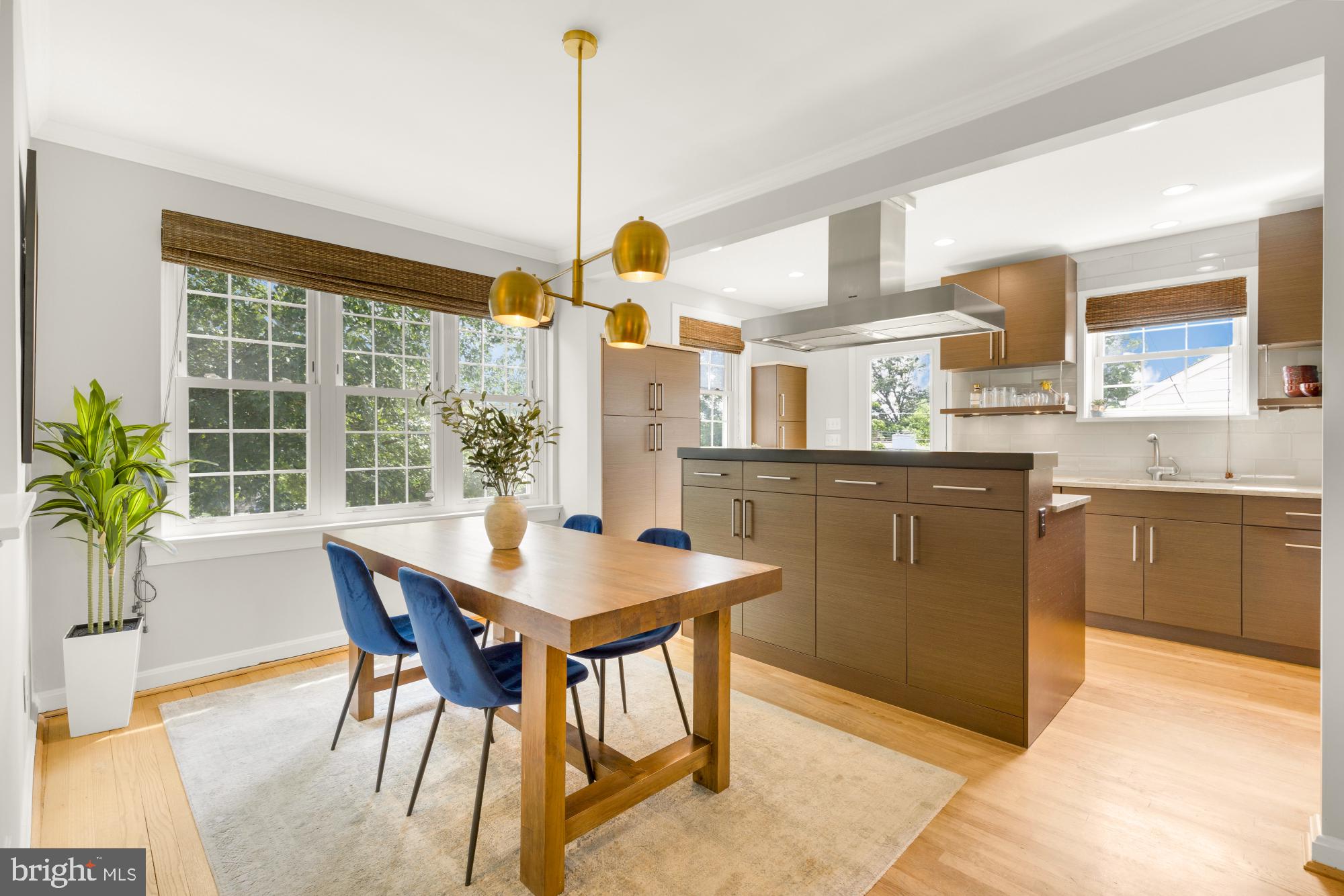 2611 Ross Road Chevy Chase, MD 20815 - Photo 9 of 37 a kitchen with a table and chairs in it