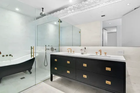 a bathroom with a sink and mirror