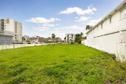 a view of yard with swimming pool and outdoor seating