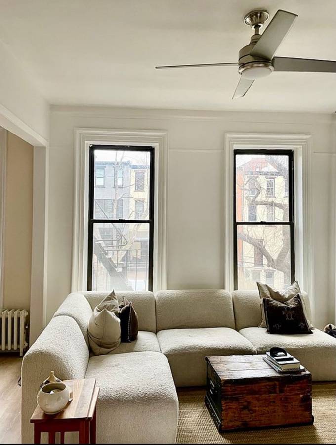 393 Clermont Avenue, Unit 3 Brooklyn, NY 11238 - Photo 4 of 10 a living room with furniture and a window