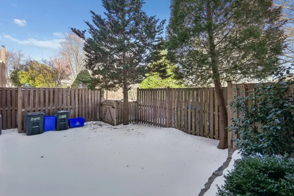 a view of outdoor space with wooden fence