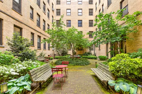 a view of a building with sitting area