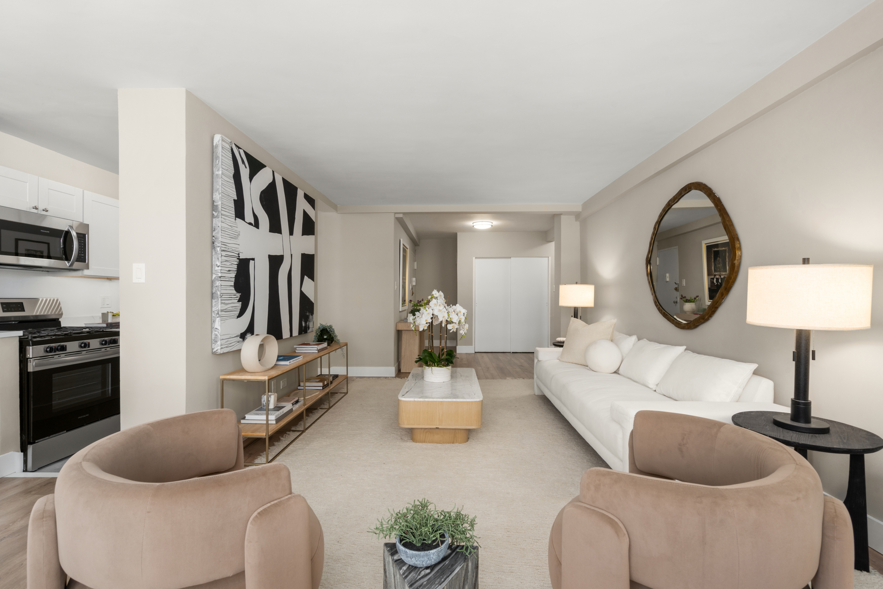 347 East 53rd Street, Unit 2C Manhattan, NY 10022 - Photo 4 of 18 a living room with furniture a rug and a flat screen tv