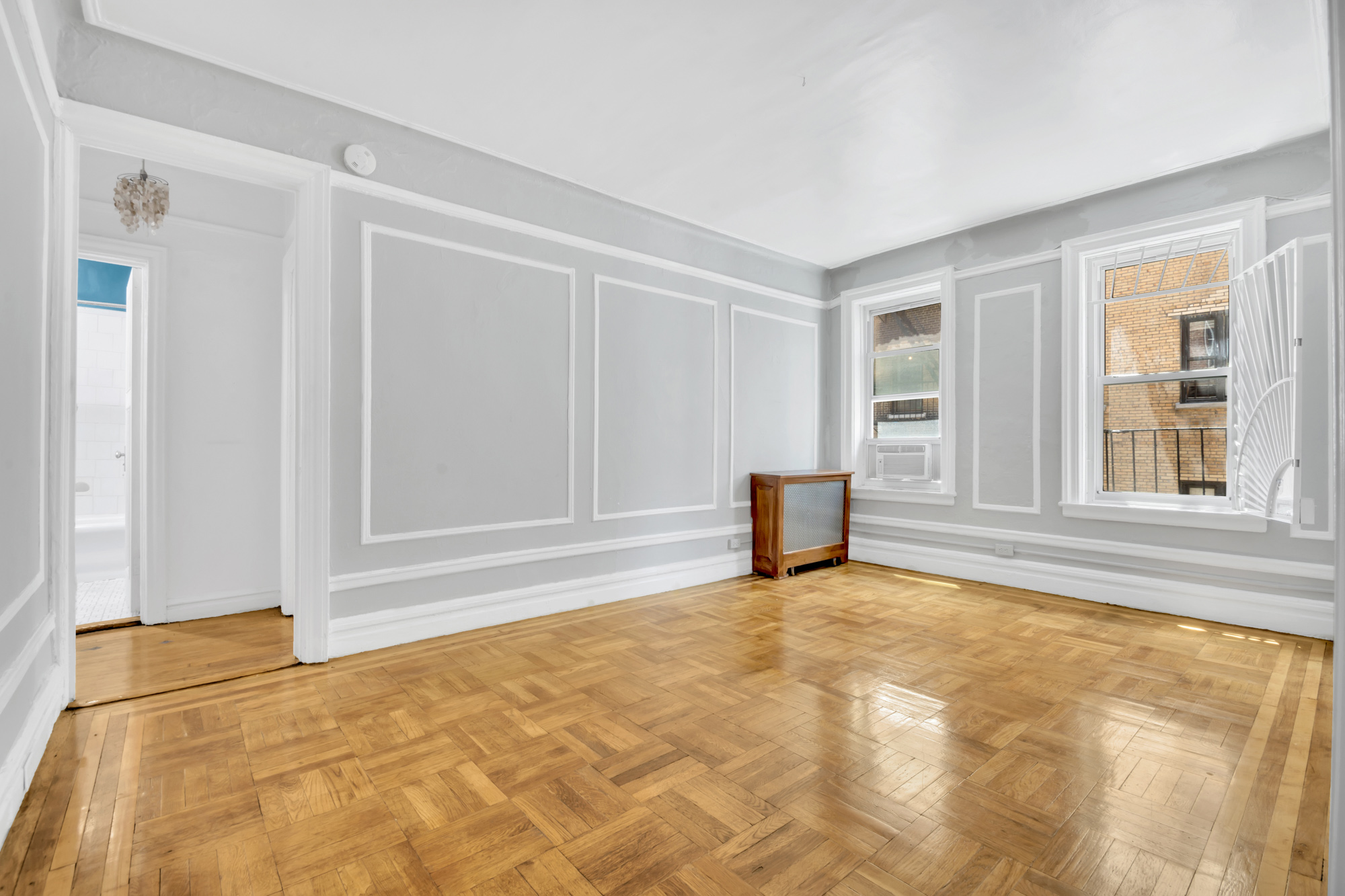 720 West 173rd Street, Unit 23 Manhattan, NY 10032 - Photo 2 of 10 a view of an empty room with a fireplace