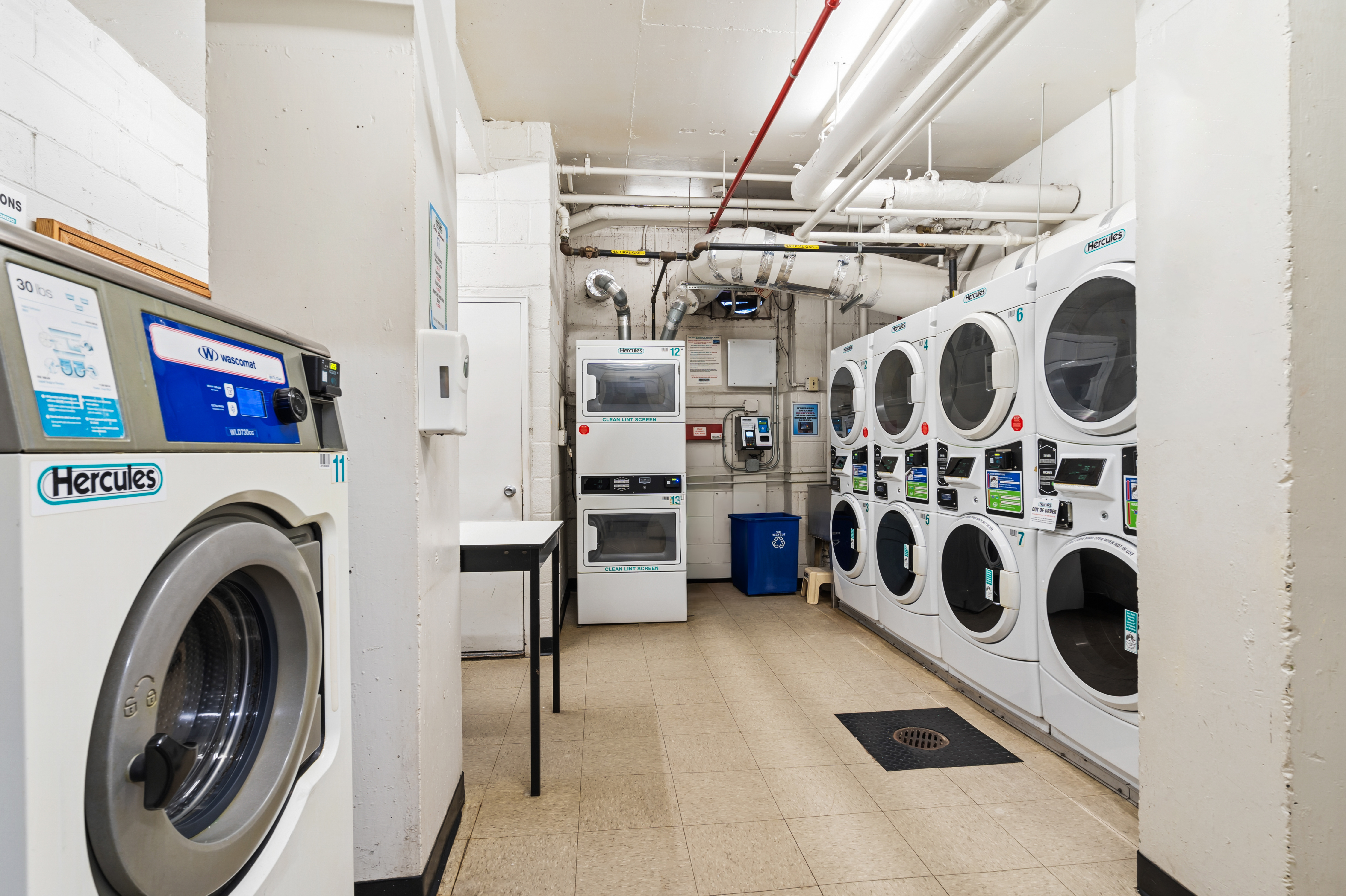 166 East 35th Street, Unit 5C Manhattan, NY 10016 - Photo 12 of 16 a utility room with dryer and washer