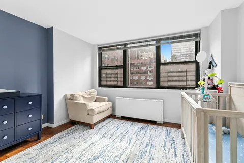 a living room with furniture and windows