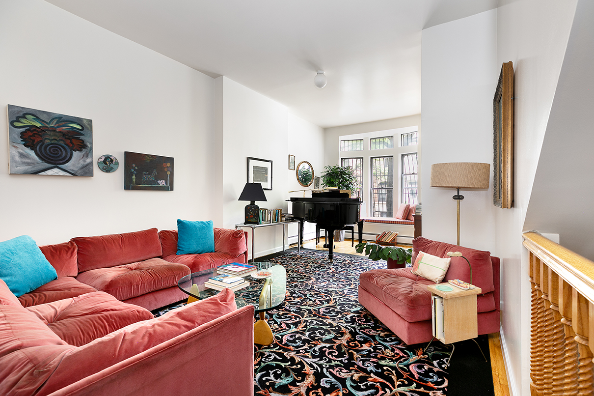 530 West 148th Street Manhattan, NY 10031 - Photo 4 of 14 a living room with furniture and a flat screen tv