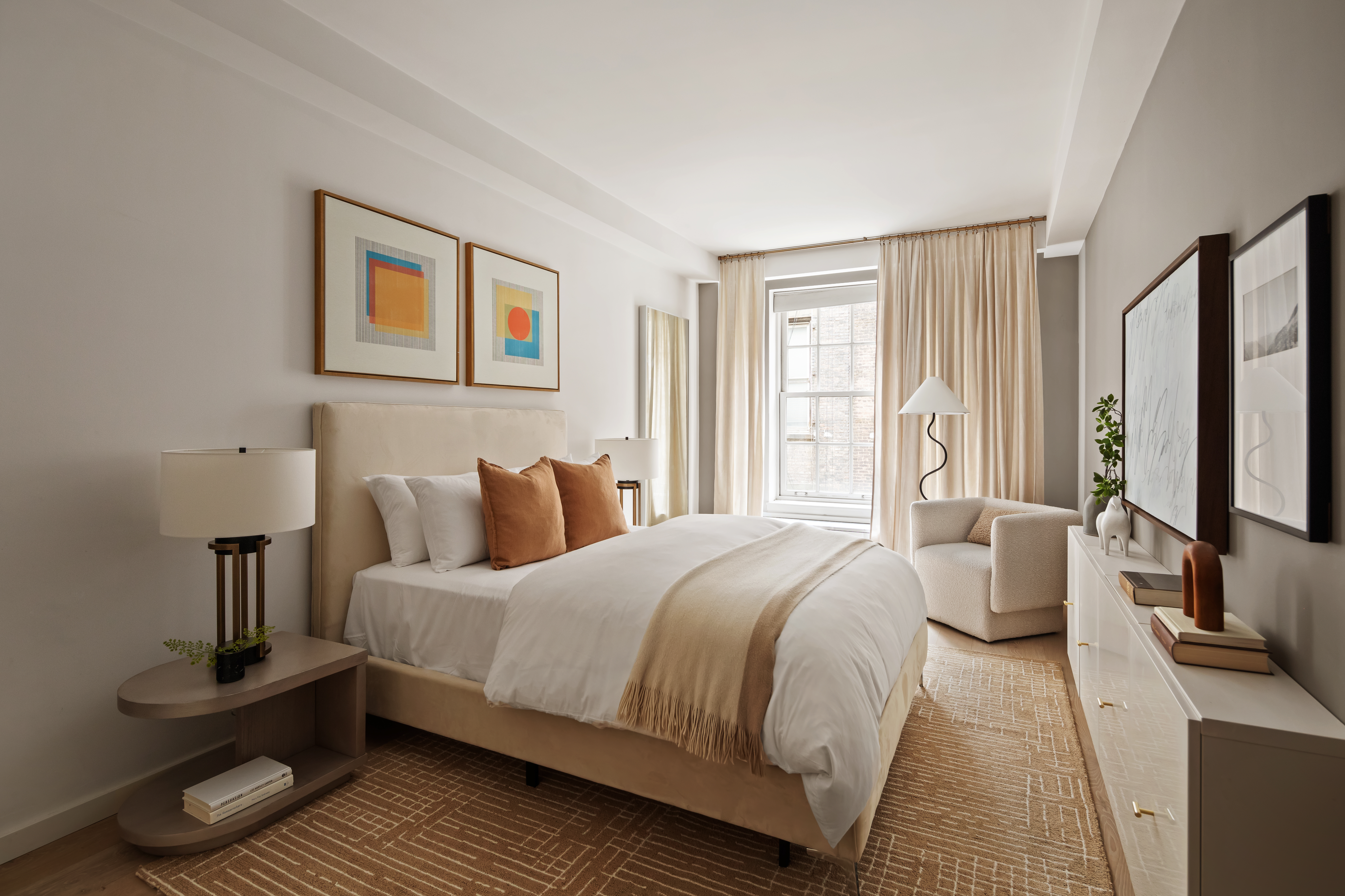 115 Mercer Street, Unit 4A Manhattan, NY 10012 - Photo 13 of 15 a bedroom with a bed and wooden floor