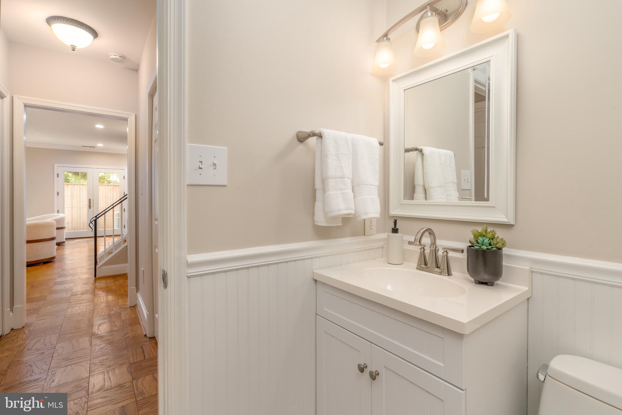 3299 Sutton Place Northwest, Unit C Washington, DC 20016 - Photo 20 of 41 a bathroom with a sink and a mirror