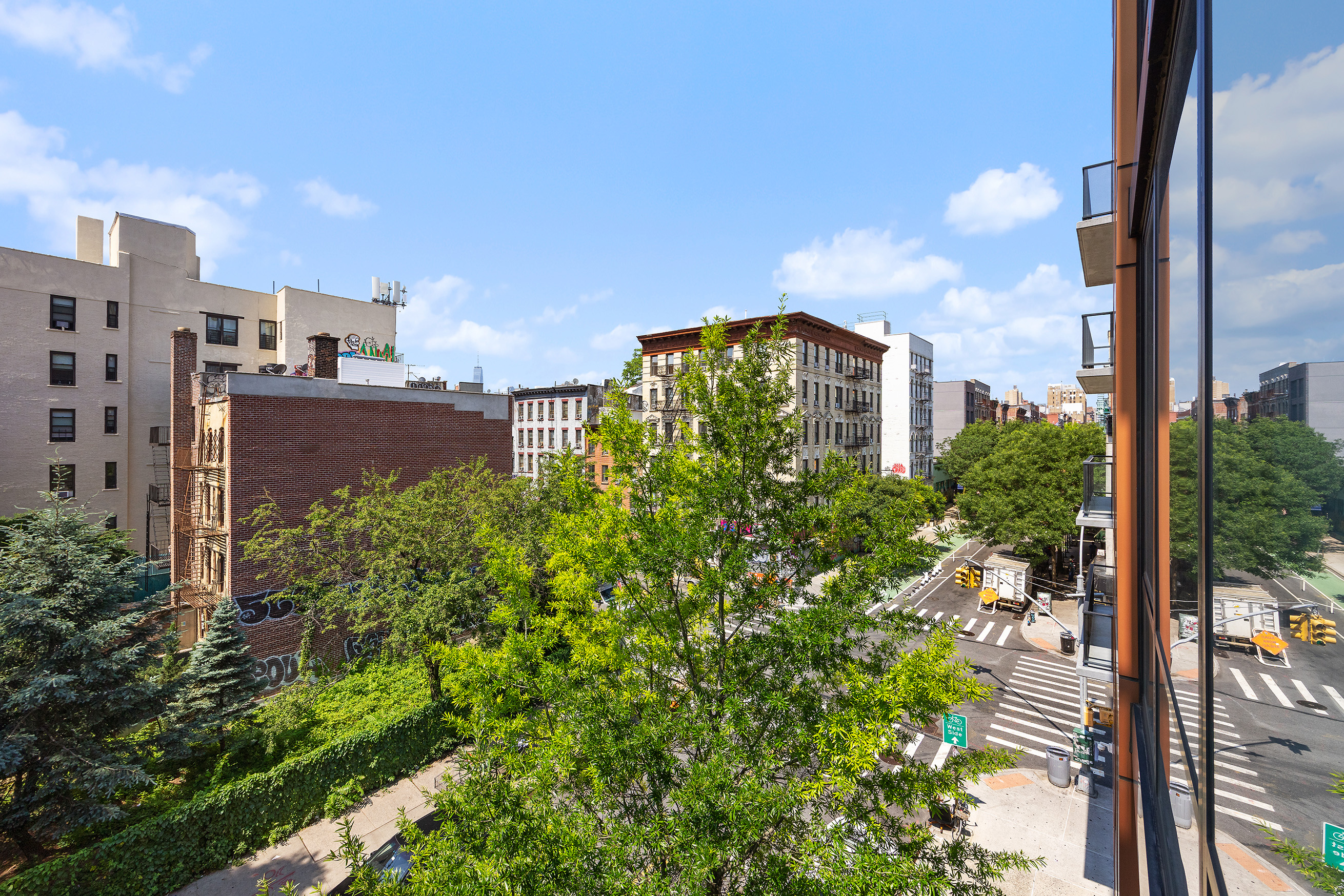 215 Avenue B, Unit 4A Manhattan, NY 10009 - Photo 9 of 13 a view of a city with tall buildings