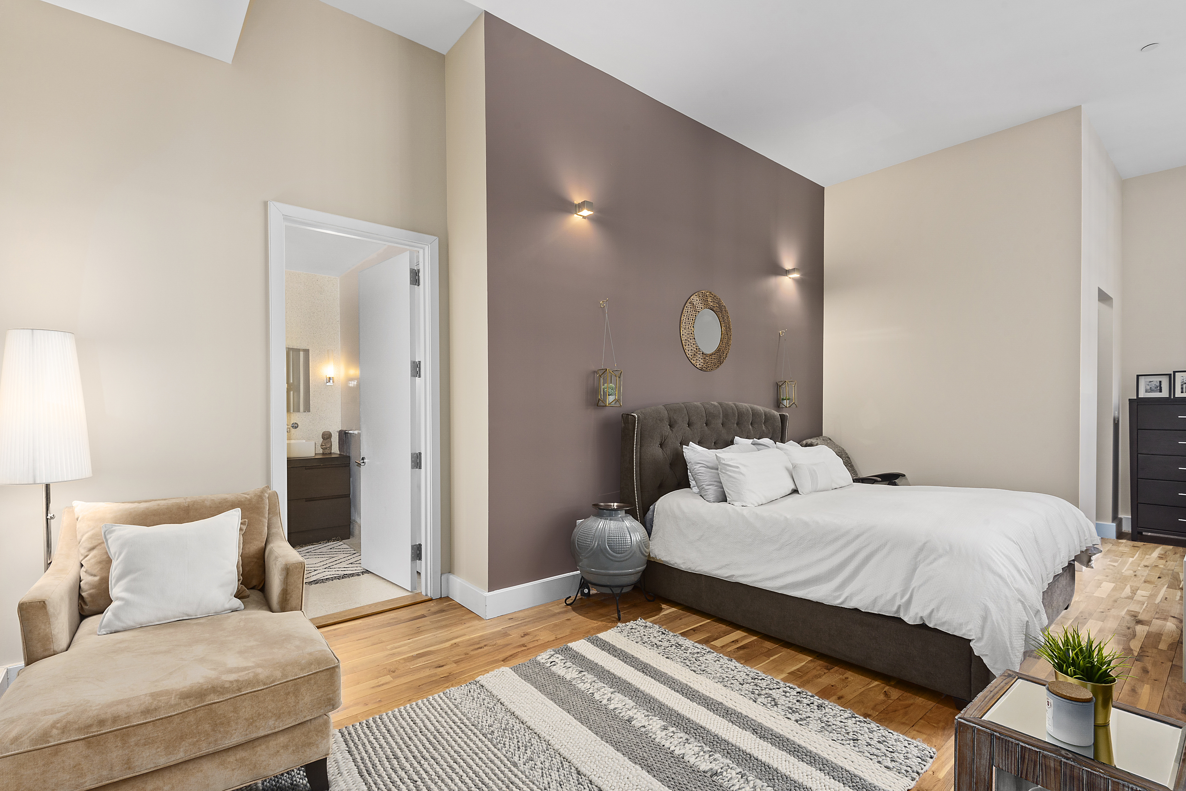 360 Furman Street, Unit 723/724 Brooklyn, NY 11201 - Photo 21 of 63 a bedroom with a large bed and a chandelier