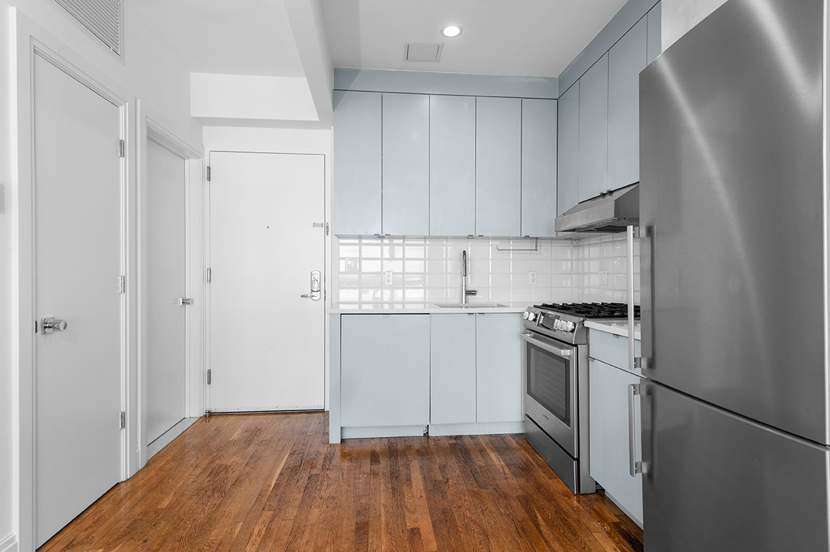 686 MacDonough Street, Unit 2A Brooklyn, NY 11233 - Photo 6 of 8 a kitchen with a sink cabinets stainless steel appliances and a window
