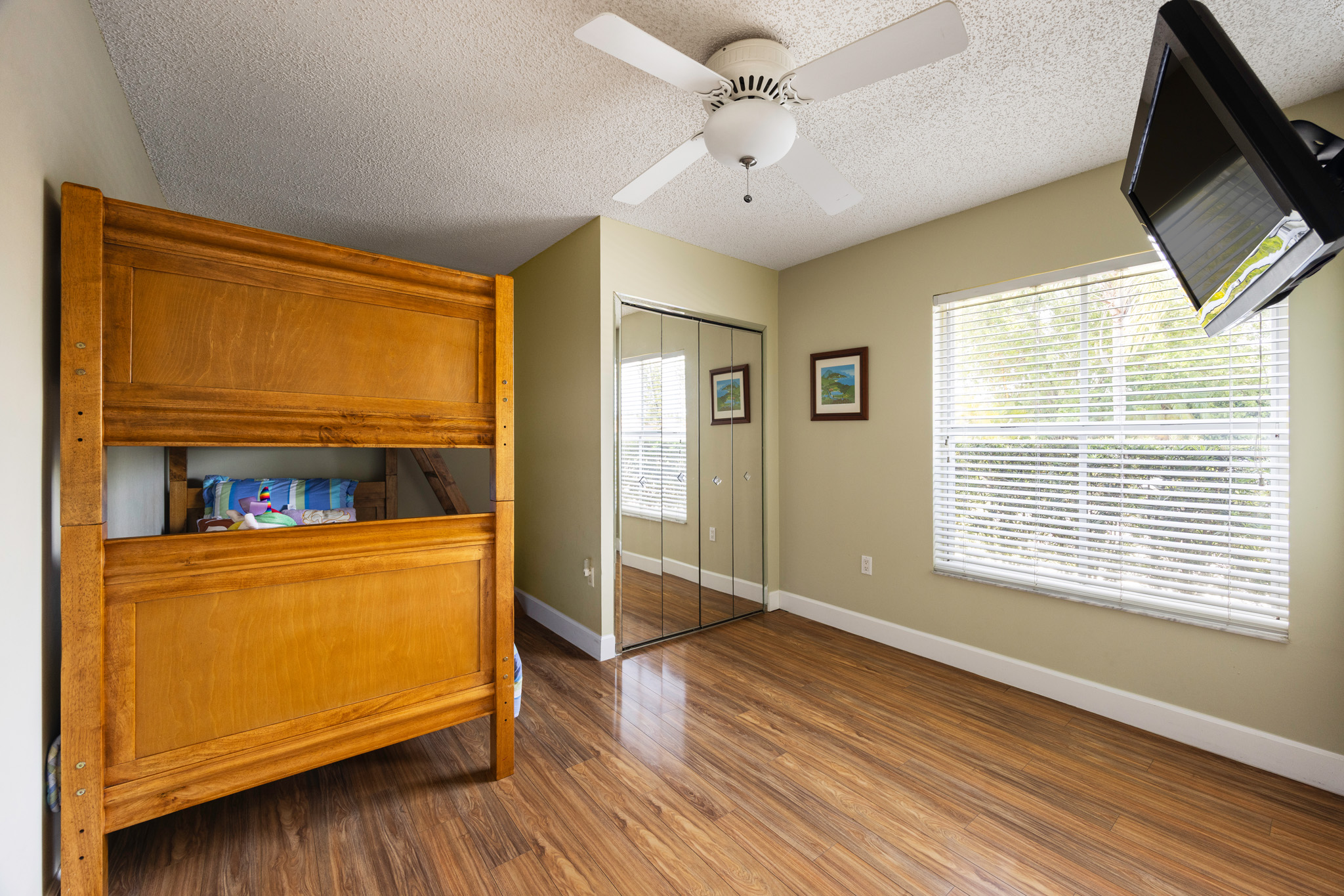 8610 Southwest 83rd Street Miami, FL 33143 - Photo 27 of 46 a view of an empty room with a window and wooden floor