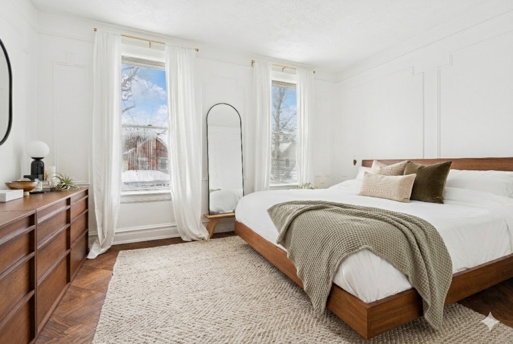 527 East 38th Street Brooklyn, NY 11203 - Photo 5 of 15 a spacious bedroom with a bed a dresser and a large mirror
