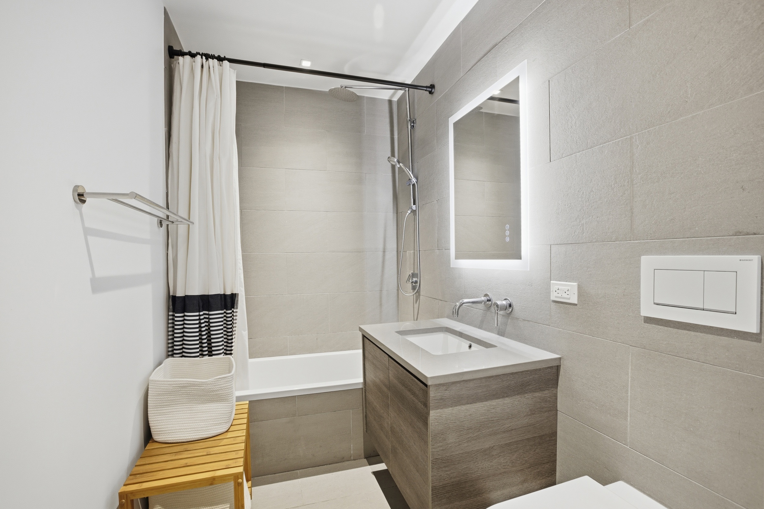 313 West 121st Street, Unit 2 Manhattan, NY 10027 - Photo 9 of 12 a bathroom with a sink a toilet and shower