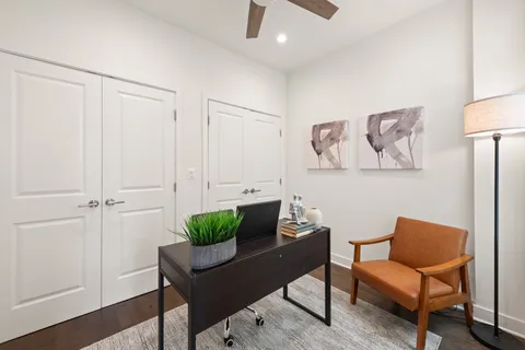 a living room with furniture and a potted plant
