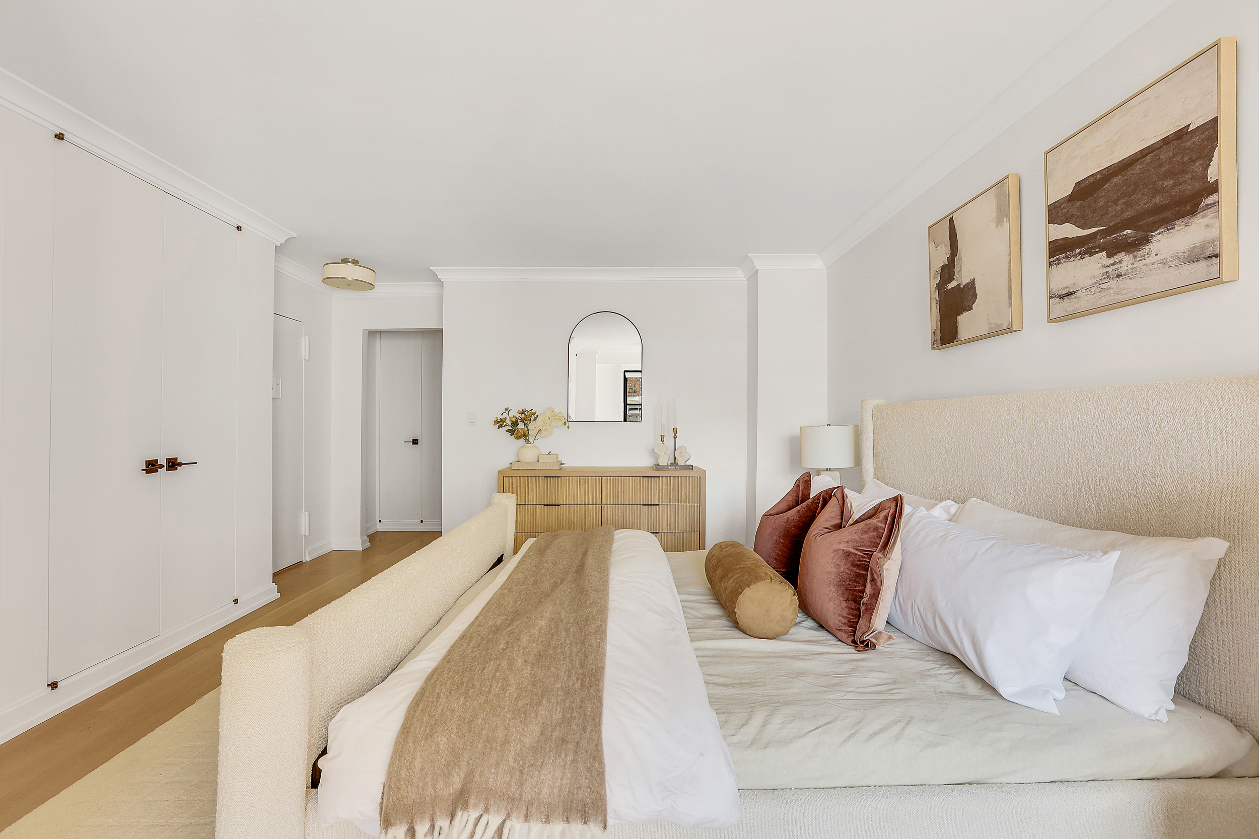 31 Jane Street, Unit 10FG Manhattan, NY 10014 - Photo 14 of 27 a bedroom with a bed and a painting on the wall