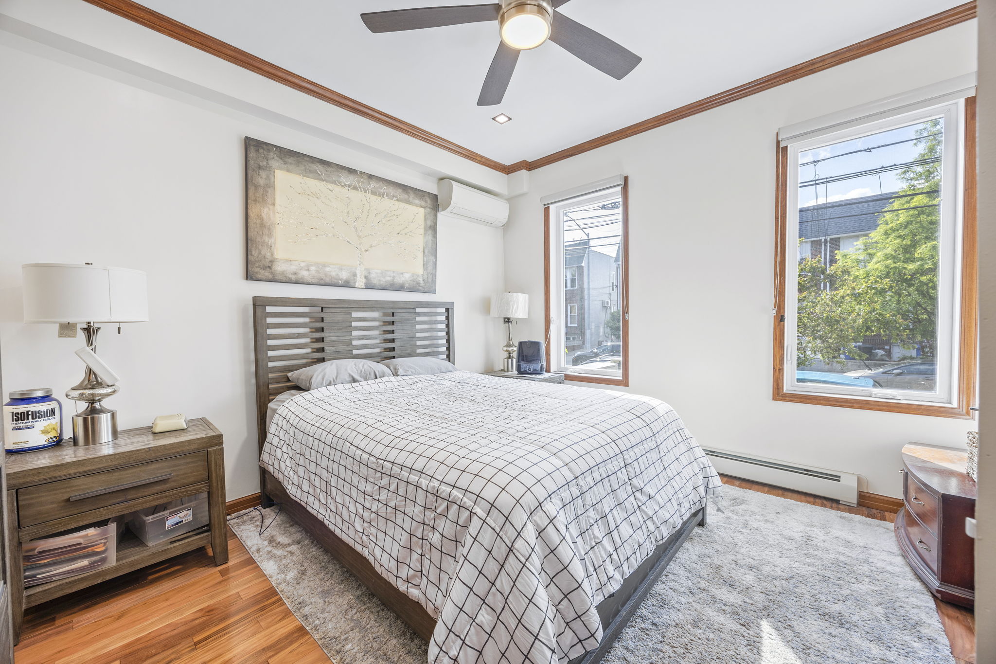 25-69 46th Street Queens, NY 11103 - Photo 24 of 33 a bedroom with a bed and wooden floor