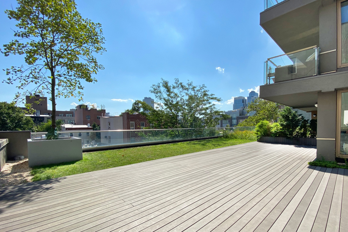144 North 8th Street, Unit 12A Brooklyn, NY 11249 - Photo 19 of 21 a view of a terrace with a yard