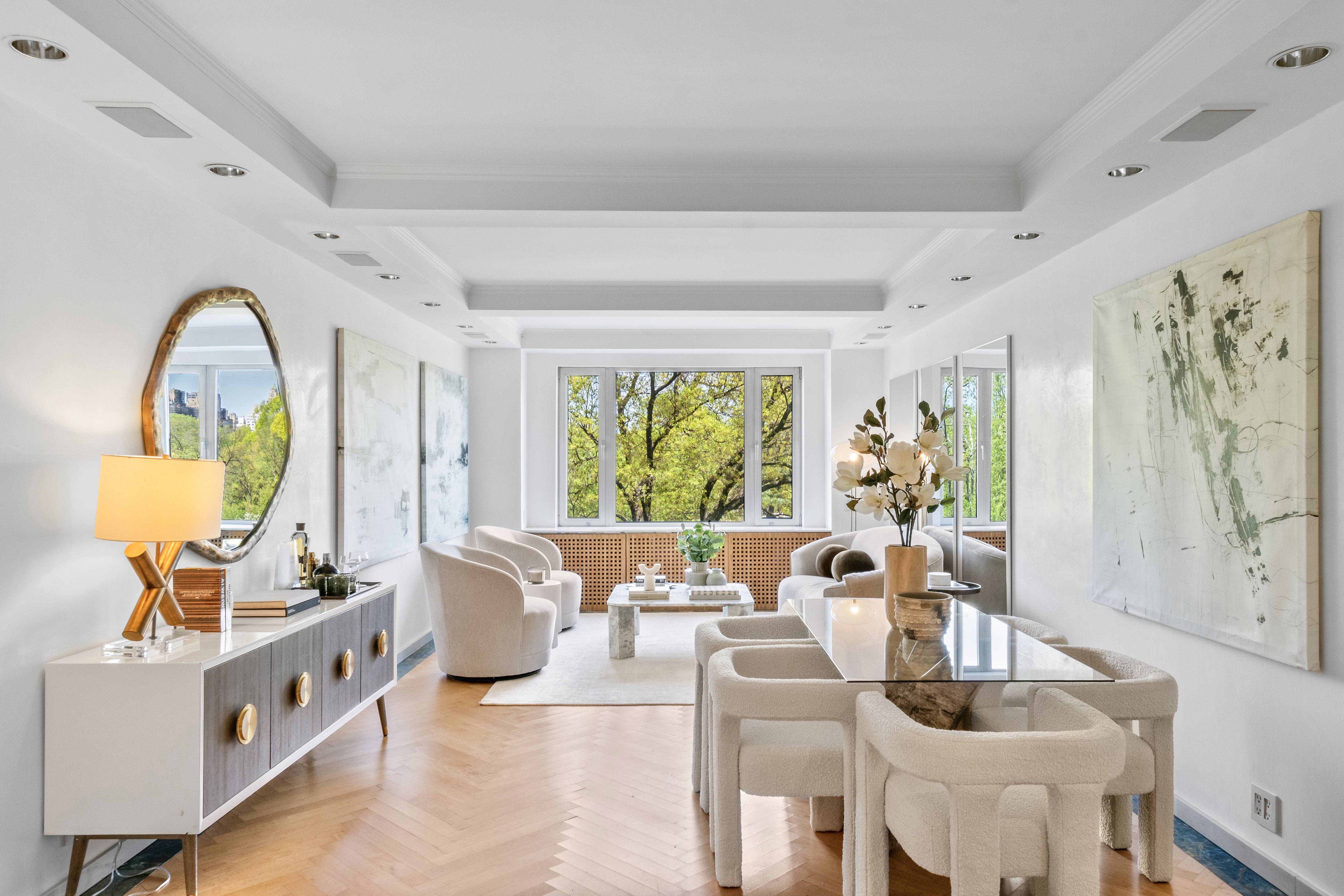 a living room with fireplace furniture and a large window