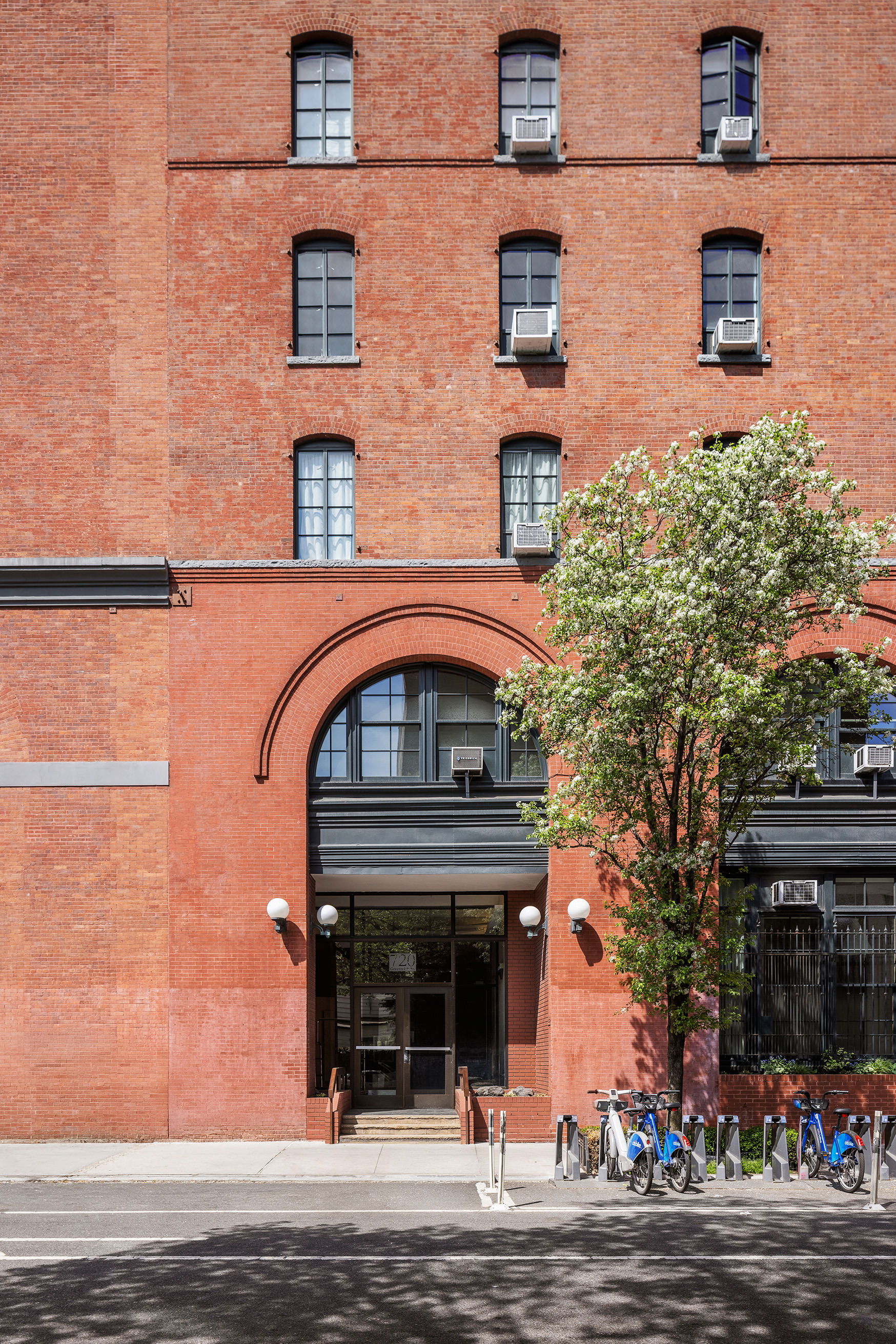 720 Greenwich Street, Unit 1F New York, NY 10014 - Photo 13 of 16 front view of a building with a garden