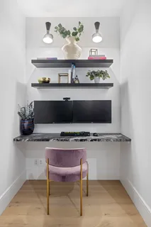 a room with a table and potted plant