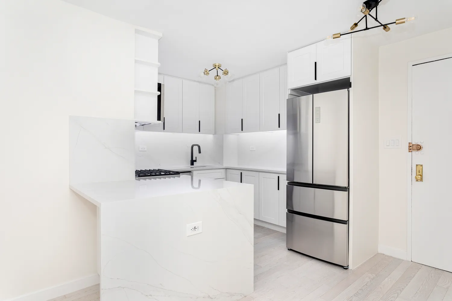 a refrigerator freezer sitting in a kitchen