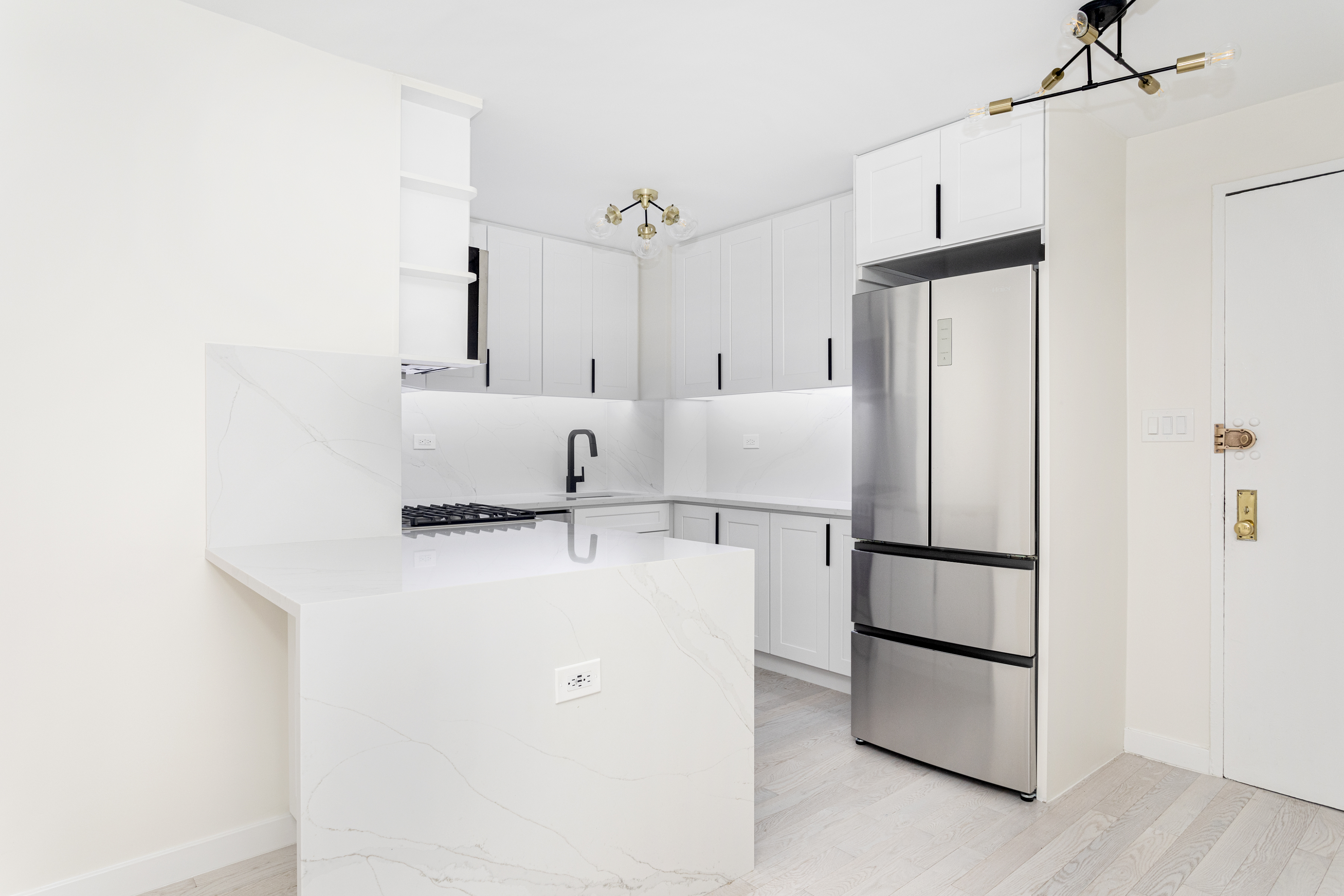 a refrigerator freezer sitting in a kitchen