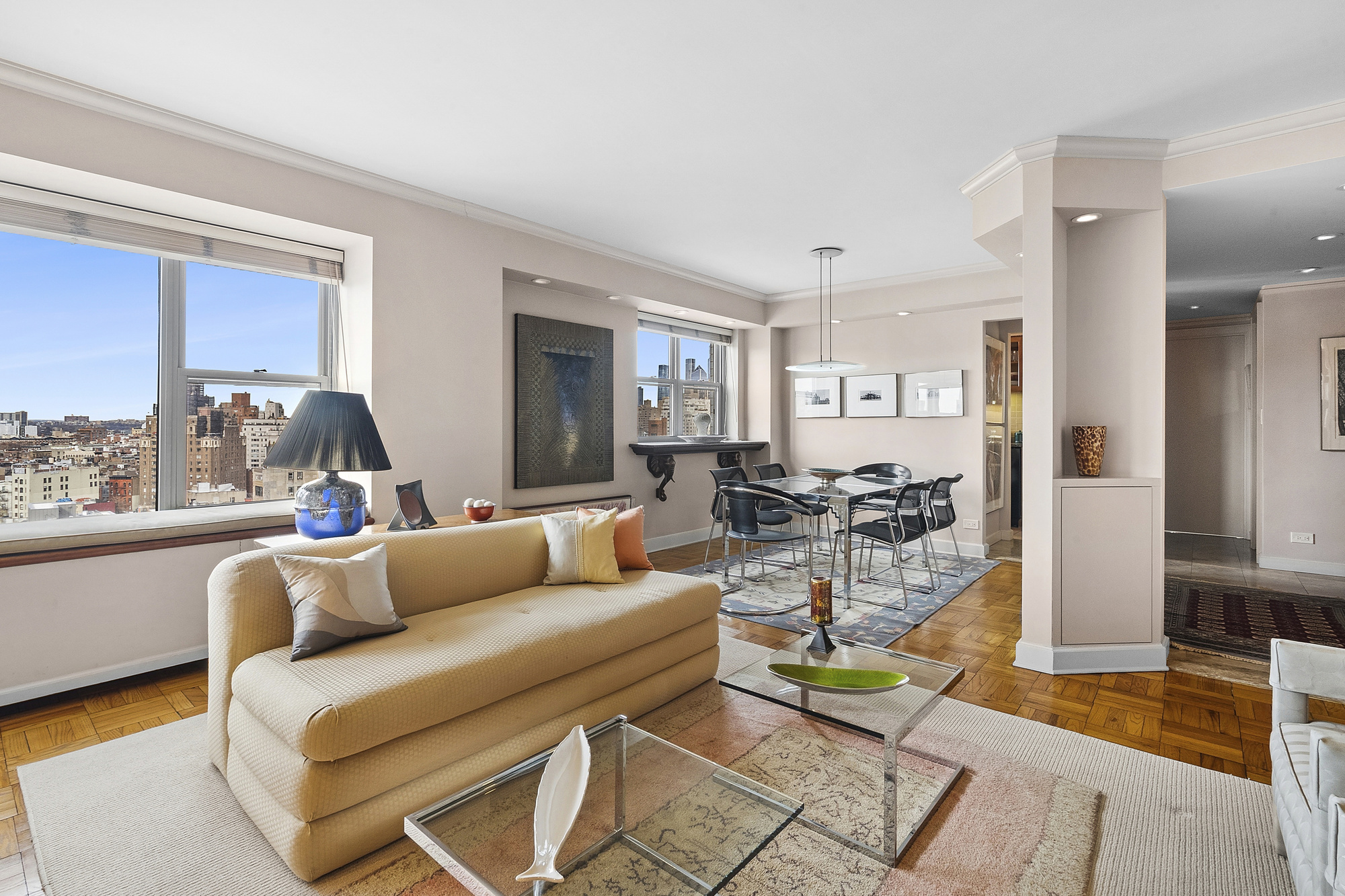 2 5th Avenue, Unit 15U Manhattan, NY 10011 - Photo 2 of 13 a living room with furniture and a large window