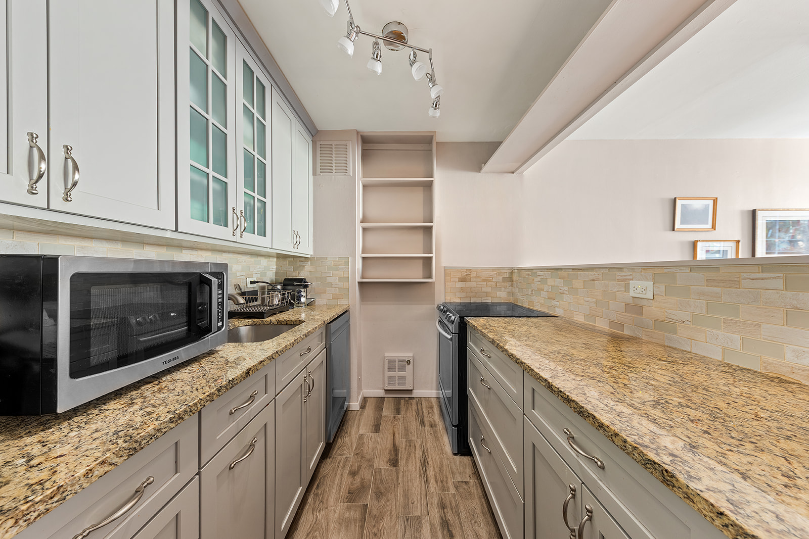 680 Washington Street, Unit 1B Manhattan, NY 10014 - Photo 2 of 13 a kitchen with stainless steel appliances granite countertop a stove and a sink