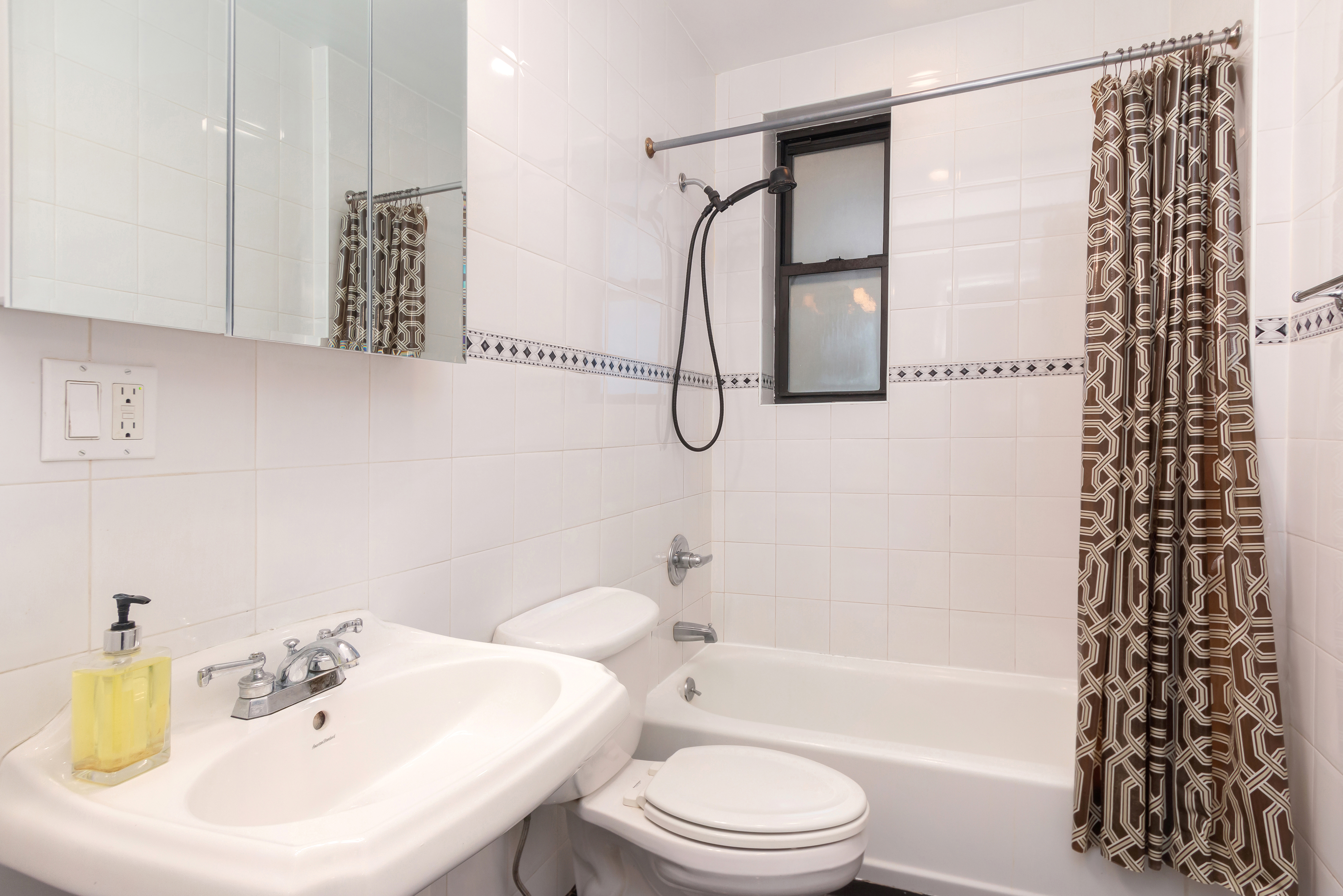 801 Riverside Drive, Unit 4F Manhattan, NY 10032 - Photo 12 of 13 a bathroom with a sink a toilet and shower