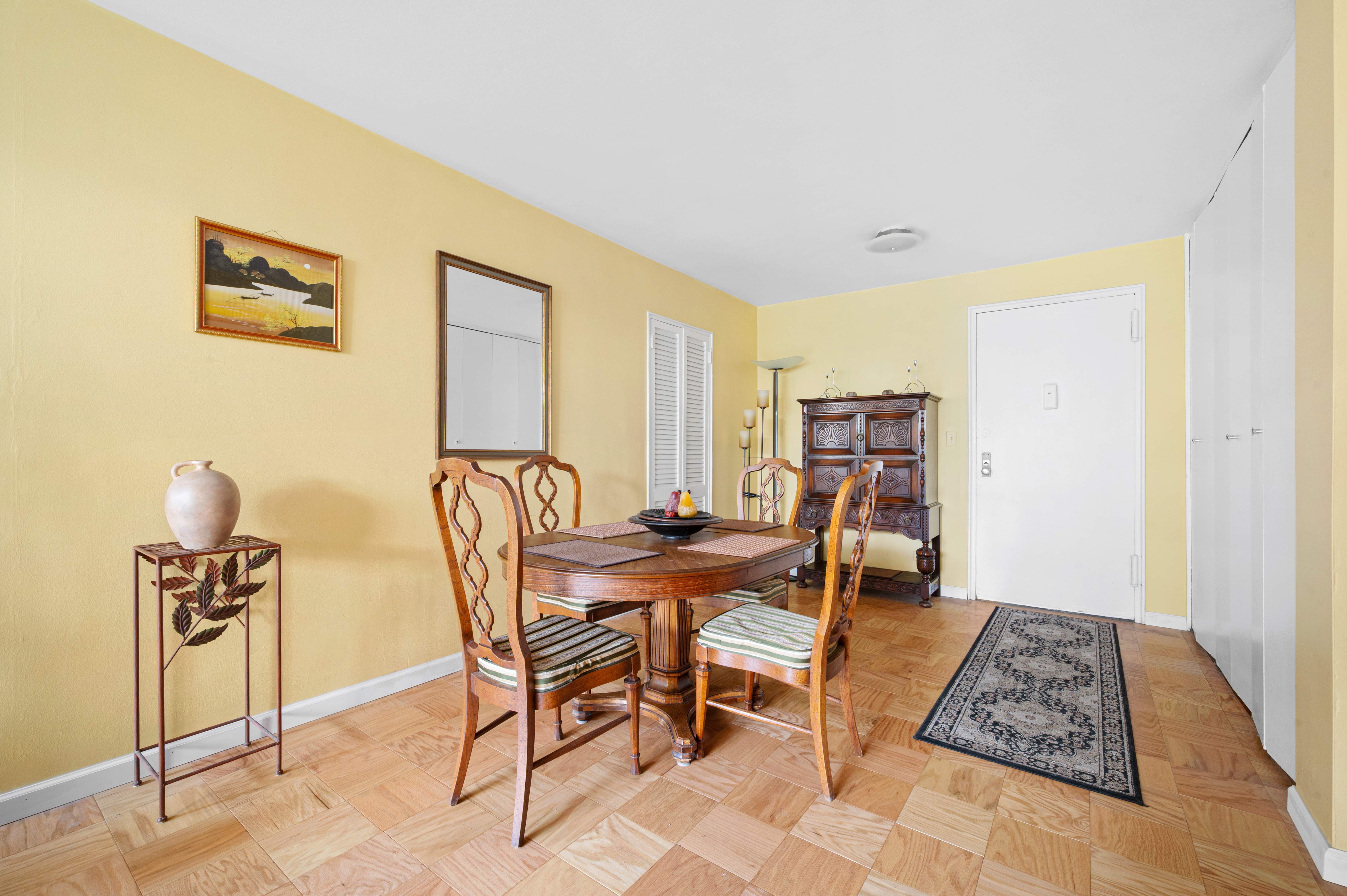 165 West 66th Street, Unit 2R Manhattan, NY 10023 - Photo 2 of 6 a view of a dining room with furniture and wooden floor
