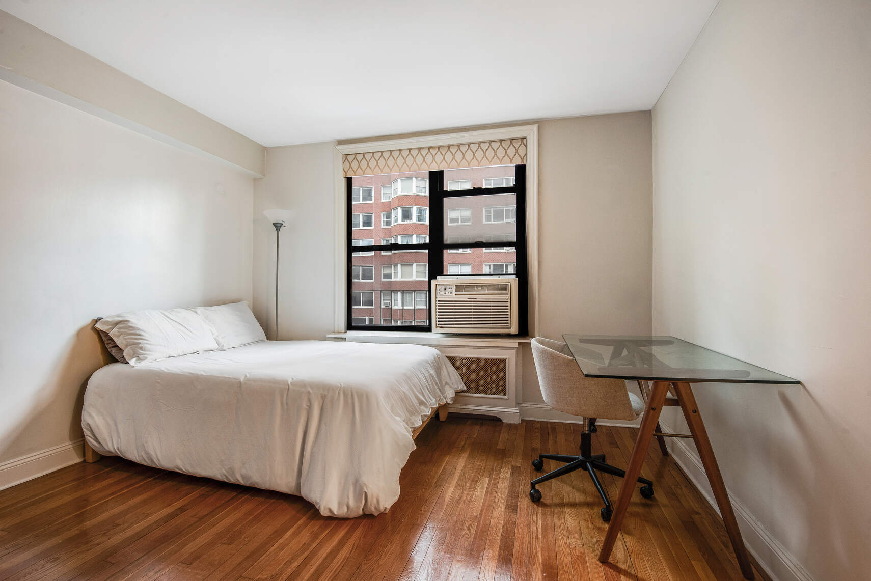 305 East 72nd Street, Unit 4CN Manhattan, NY 10021 - Photo 3 of 9 a bedroom with a bed and a window