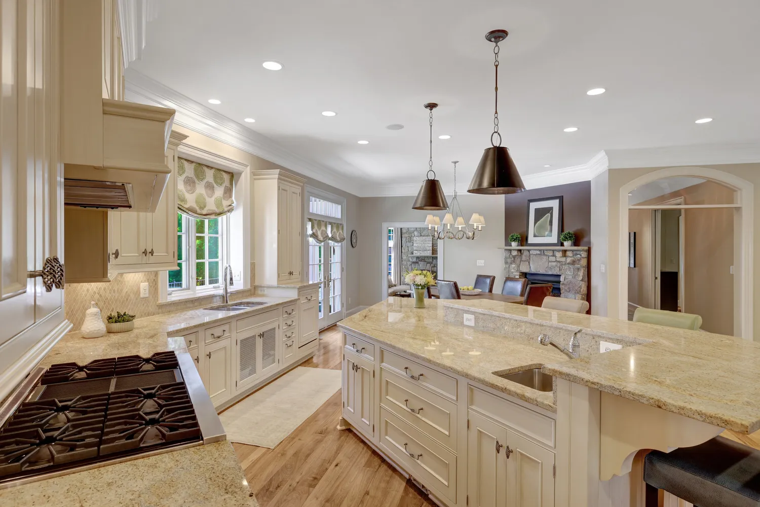 a large bed sitting in a room next to a window