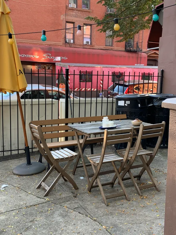 a view of a chairs and table in the patio