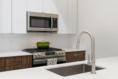 a kitchen with a stove and a microwave