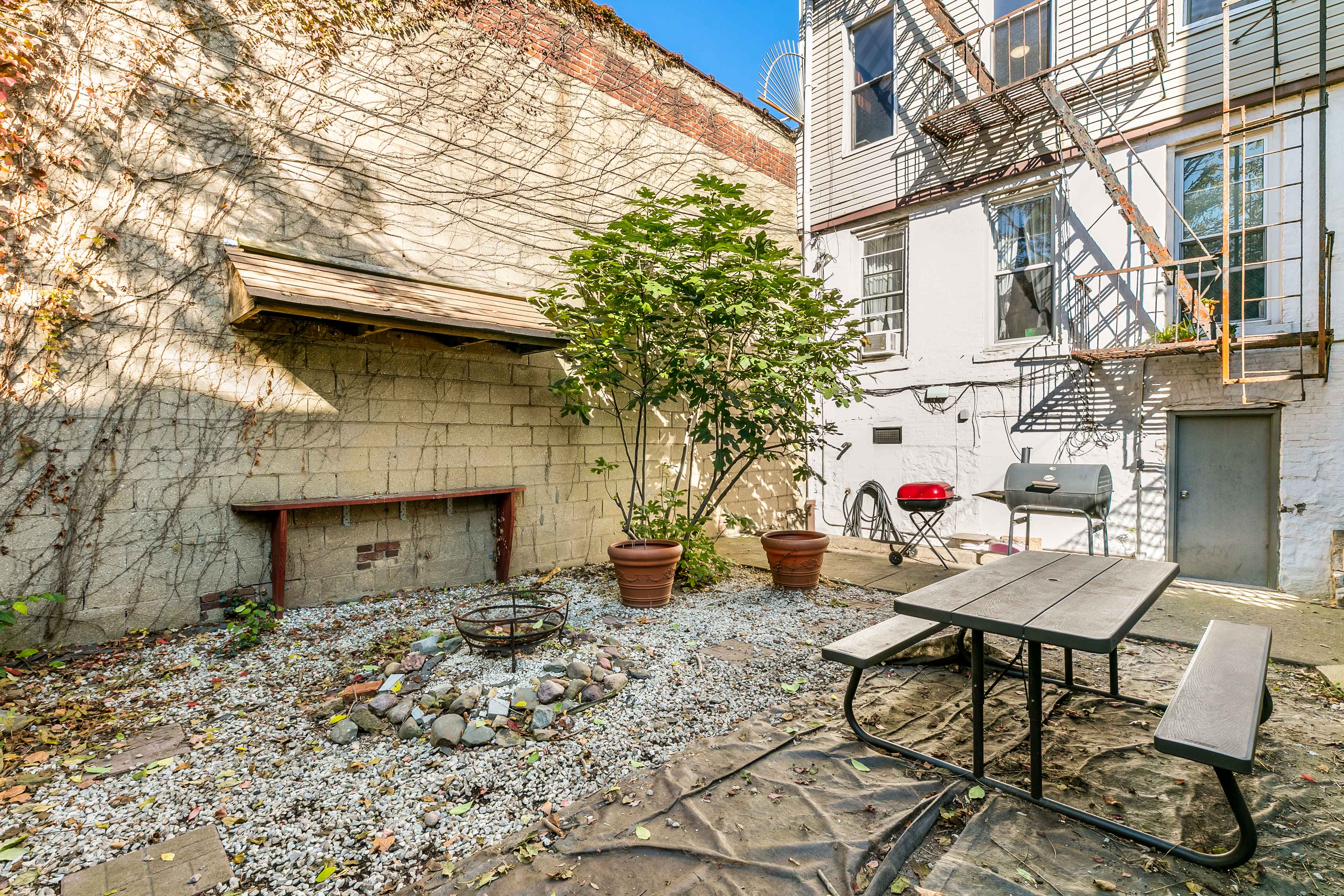 148 29th Street Brooklyn, NY 11232 - Photo 26 of 31 a view of a chairs and table in the patio