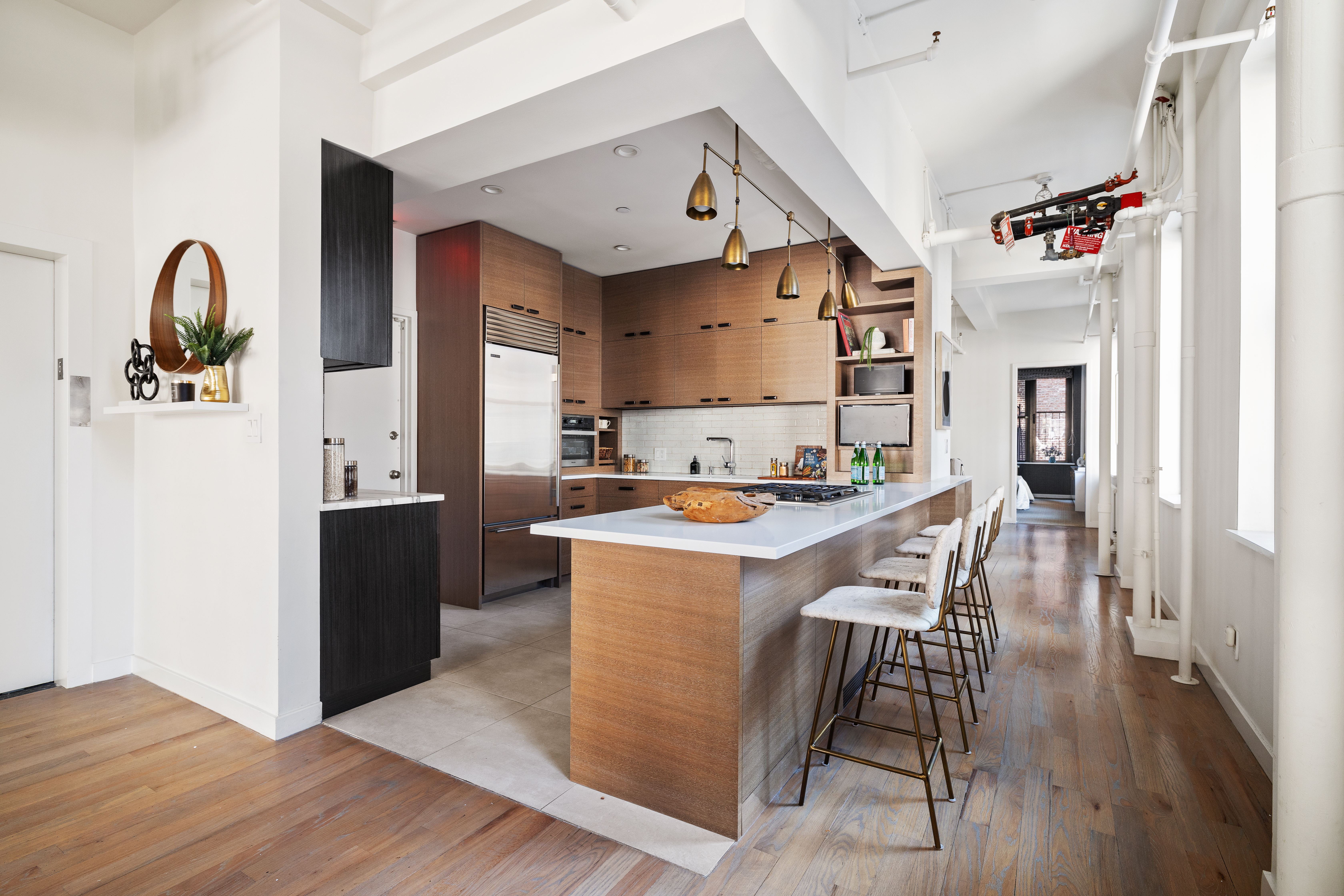 24 West 30th Street, Unit 6 Manhattan, NY 10001 - Photo 4 of 14 a living room with furniture and wooden floor